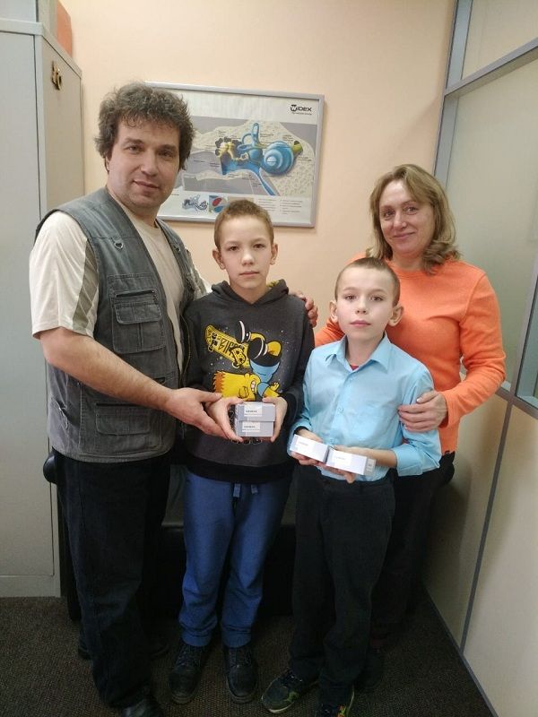 Илья и Павел Кущенко с родителями